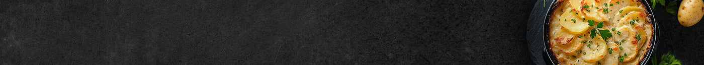Banner Kartoffel Gratin fertig gegart Schieferhintergrund