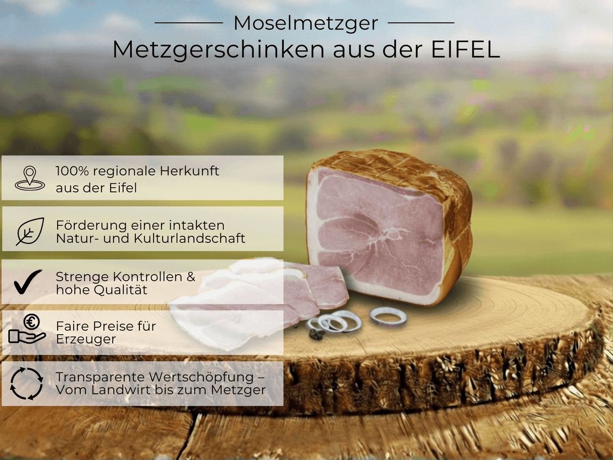 Metzgerschinken von der Regionalmarke EIFEL auf auf runder Holzplatte in der sonnigen Landschaft