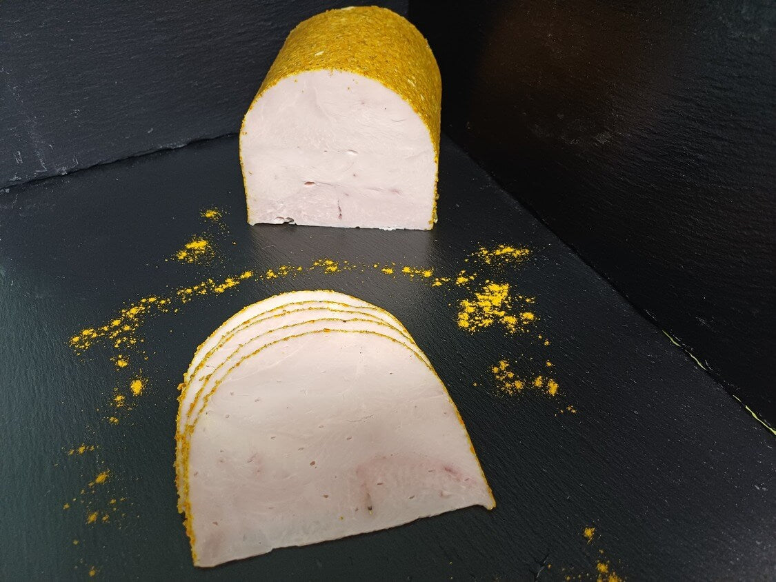 Putenbrust im Currymantel am Stück und geschnitten