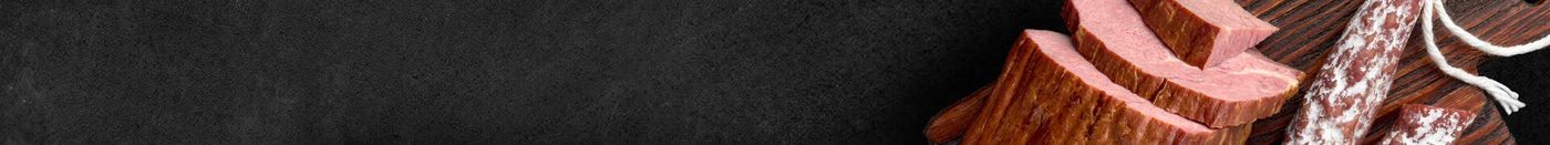 Banner Aufschnitt Brotzeit auf Schieferhintergrund