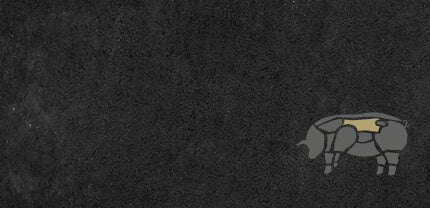 Abbildung Schweinekotelett auf Schieferhintergrund