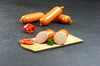 Streichmettwurst fein vom EIFEL Schwein mit Paprika und Petersilie auf Schieferhintergrund