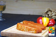 Rückensteak Paprika vom EIFEL Schwein auf Holzbrett mit Paprika auf Schieferhintergrund
